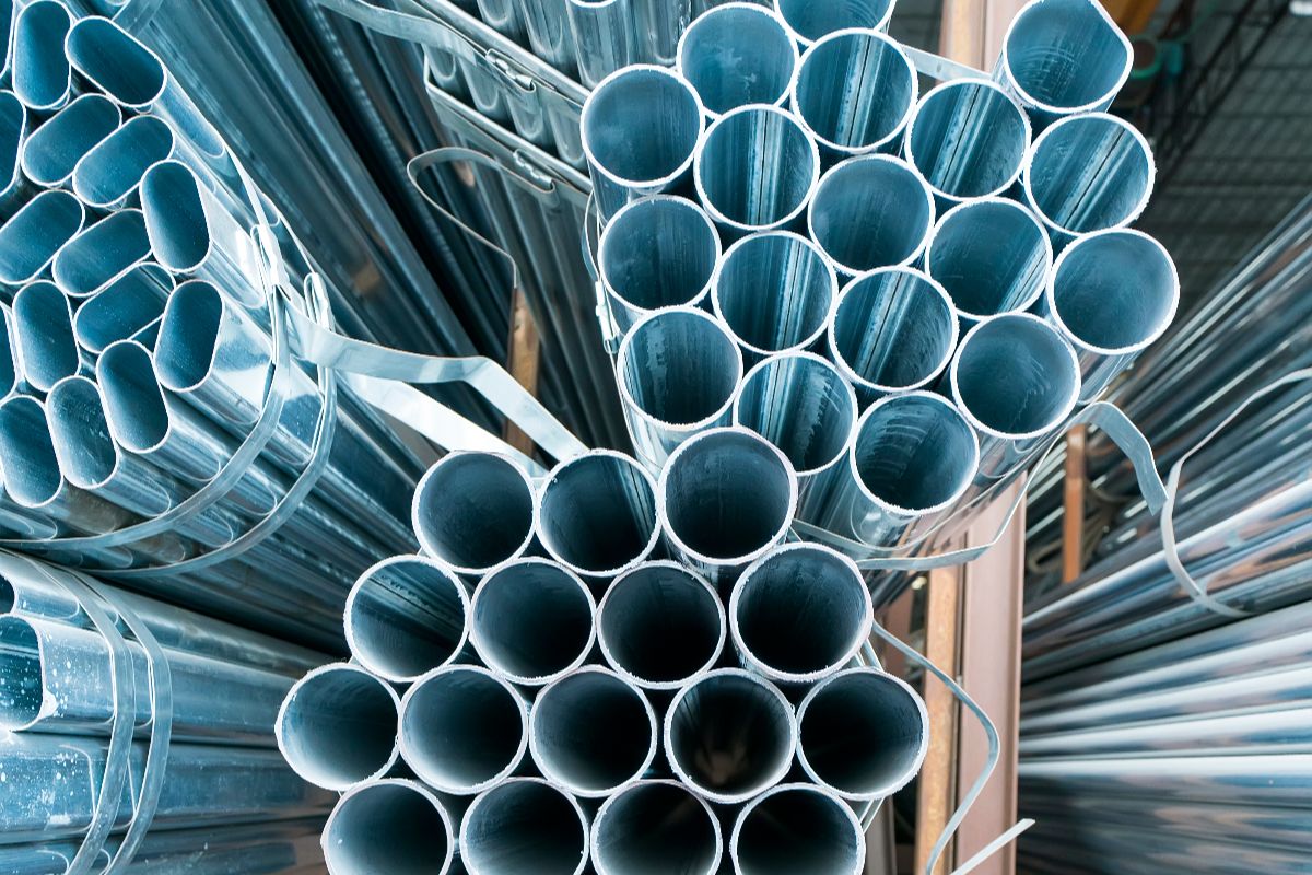 Close-up of bundled black iron pipes for industrial and construction use