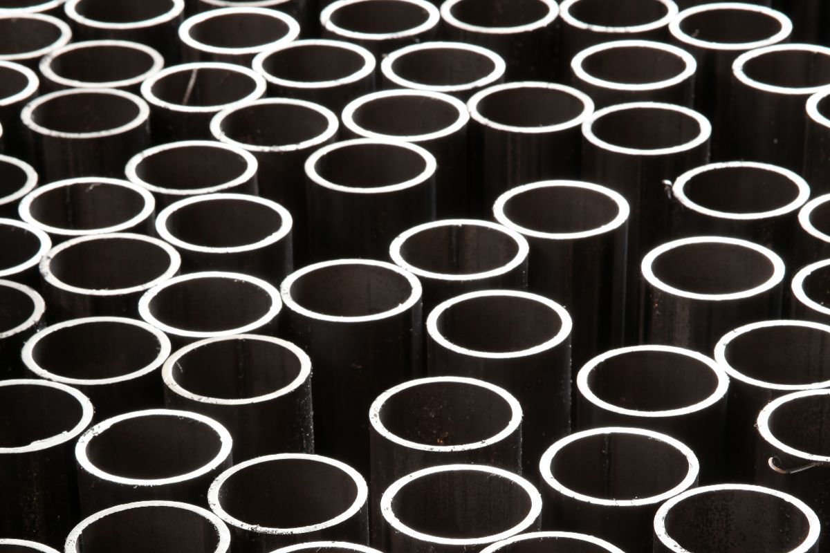 Close-up of GI pipe openings arranged in rows, highlighting pipe thickness and material consistency
