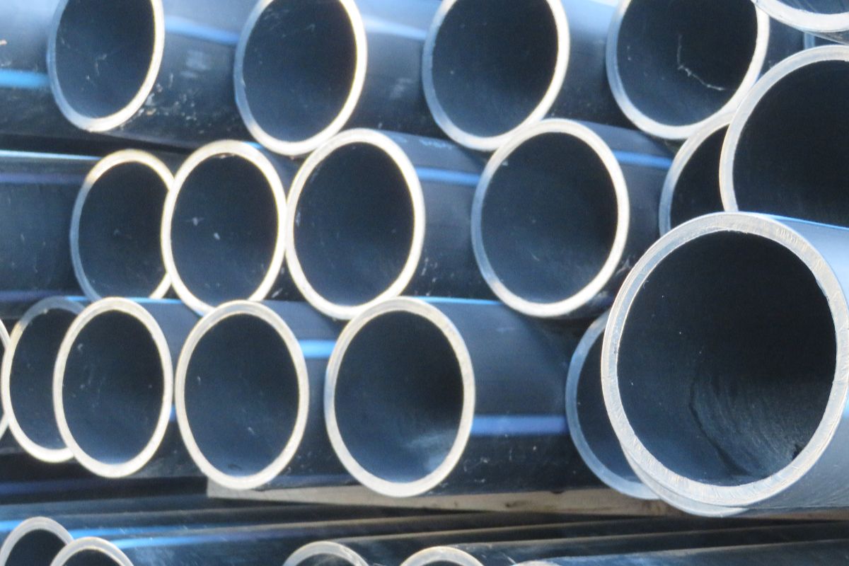 Close-up of galvanized pipe openings showing smooth coating and uniform pipe thickness